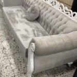 velvet and white grey 6 seater sofa with round cushion next side